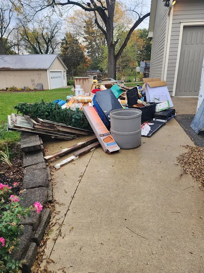 Dumpster being loaded with debris for Roofing Dumpster Rental in Chula Vista
